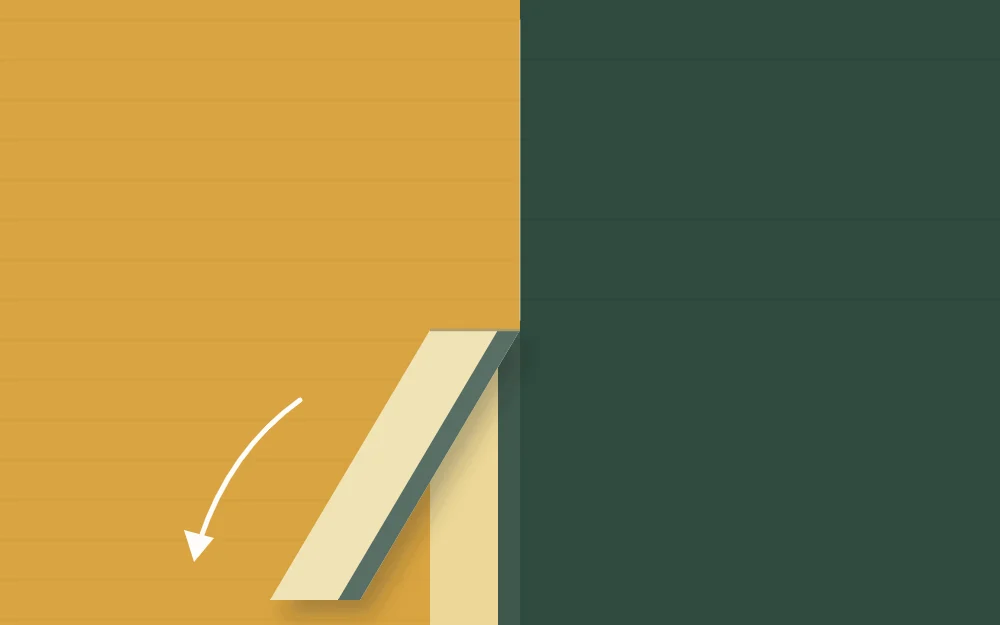 Close view of tape being peeled back at a low angle, revealing a sharp line between two colors