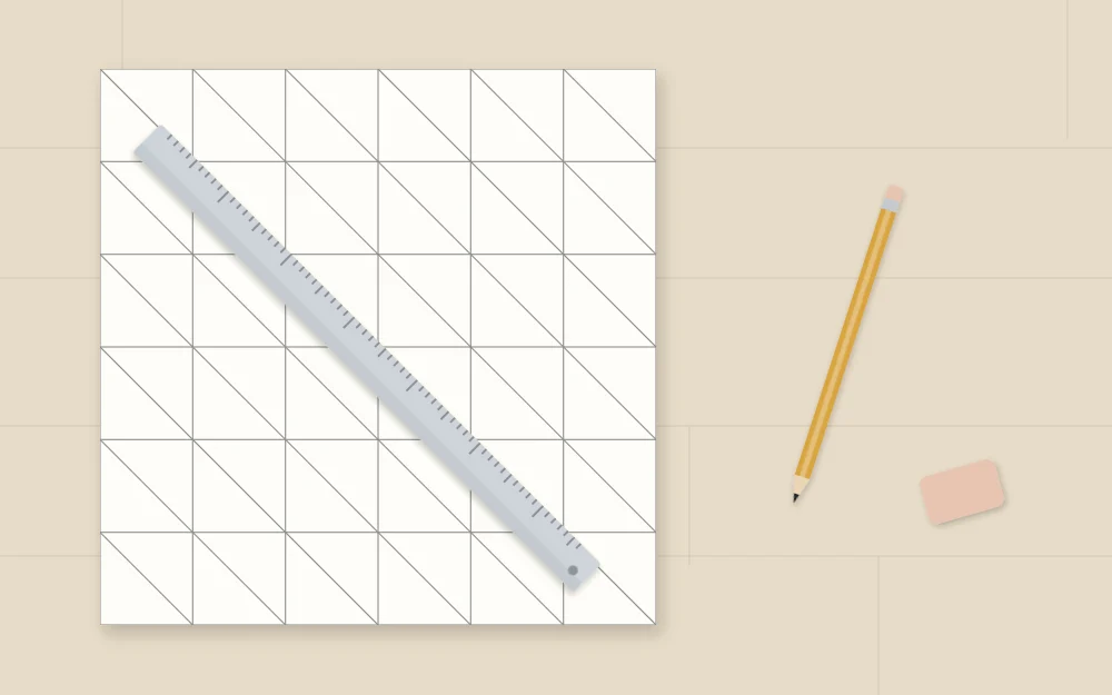A square with a faint pencil grid and diagonals dividing each cell into triangles, beside a ruler